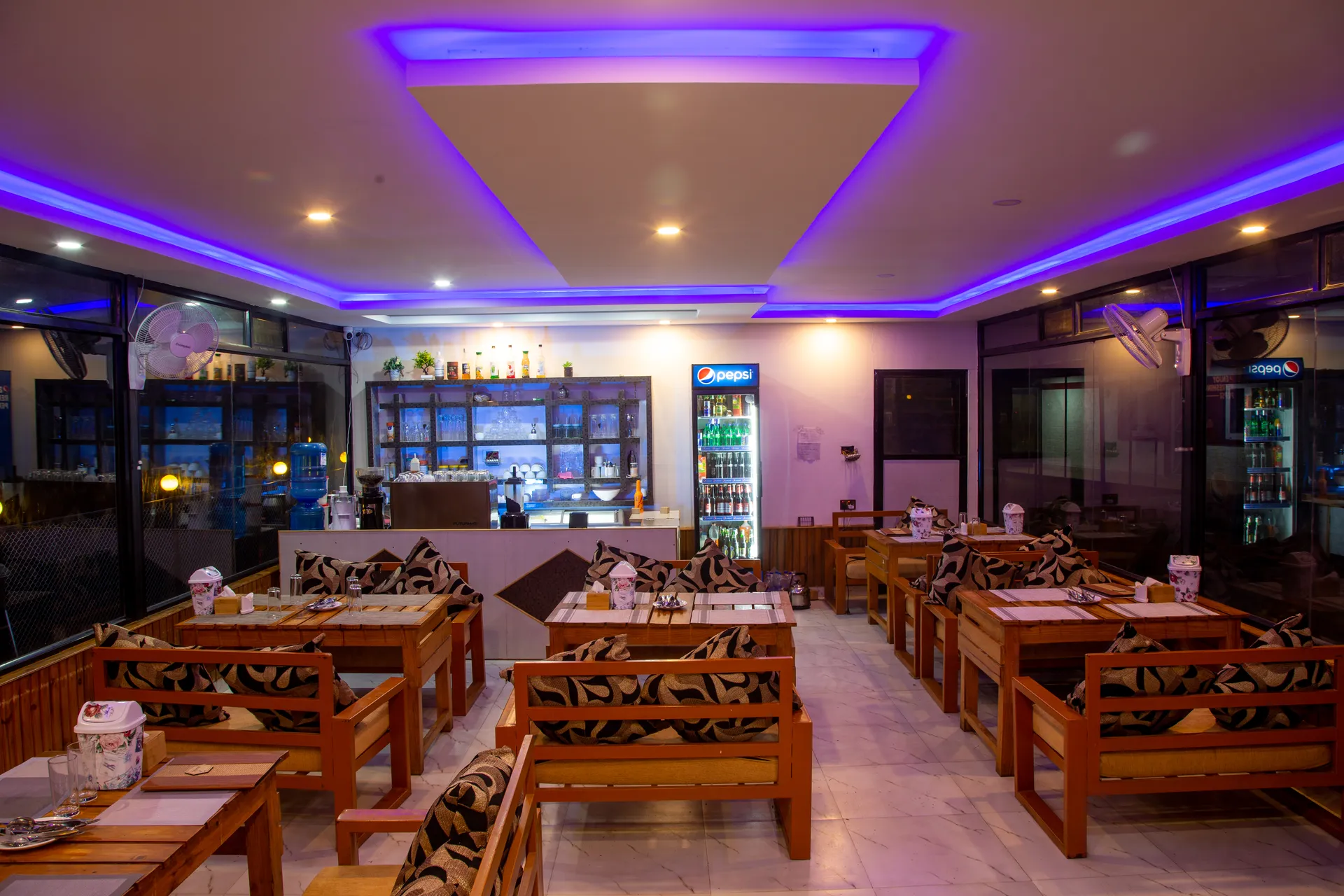 Wooden dining tables inside the resort restaurant