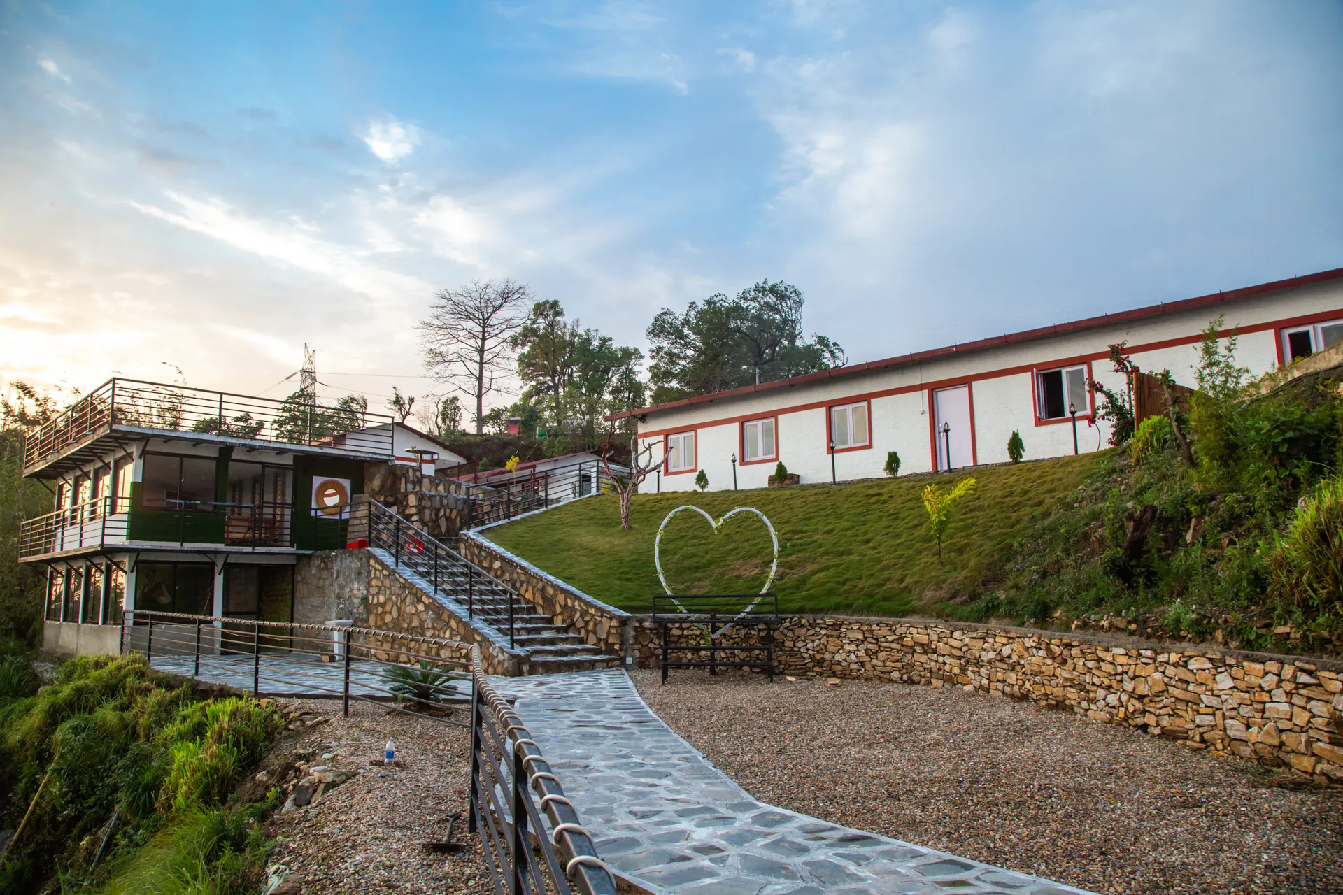 Resort buildings and stone paths on the Sindhuli hillside